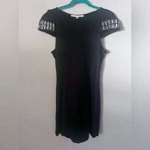 2000s Walter black knit dress with beaded cap sleeves. Size 2.
